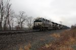 NS 4756 leads train 63V with trash down the siding